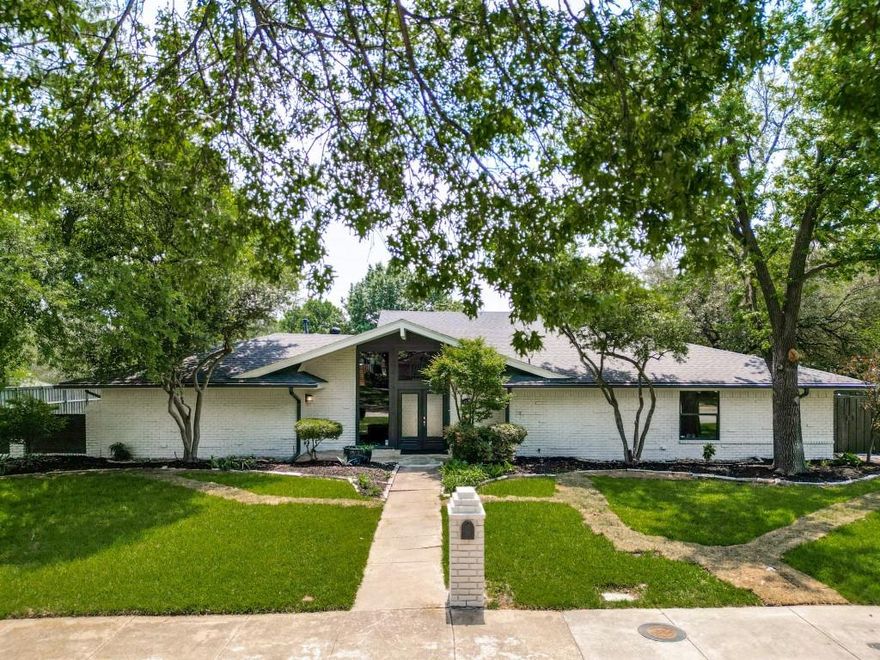 Unbeatable location! This Distinctive midcentury modern ranch delivers standout architecture, incredible curb appeal, and an entertainer’s dream layout on a stunning oversized interior corner lot. Thoughtfully designed with 2 split-level great rooms, the open-concept floorplan offers exceptional flexibility for everyday living, relaxing, or hosting guests. Engineered hardwoods, new plush carpet, 4000K LED lighting, fresh neutral interior+exterior paint selections, kitchen with stainless steel appliances, granite countertops, oversized island, and shaker-style cabinetry. The private primary retreat features an oversized walk-in shower and large walk-in closet for a true spa-like feel. Major system upgrades already completed including roof, BOTH HVAC systems, electrical, and plumbing. No cast iron plumbing — ALL new PVC plumbing installed in 2026 beneath the home and extended to the street. Enjoy the peaceful outdoor setting with a private balcony, flagstone patio, courtyard, and board-on-board fencing. 4th bedroom could easily double as private office if desired. Oversized rear-entry garage with epoxy floor offers bonus parking+storage & has updated garage doors, motors, and openers. Ultra convenient location near DNT, 635, 75. ENJOY being in close proximity to multiple country clubs, top private schools, dining+nightlife, parks, and trail systems. Pride of ownership is evident here. Opportunities to own a home like this are rare—don’t miss your chance to make it yours!