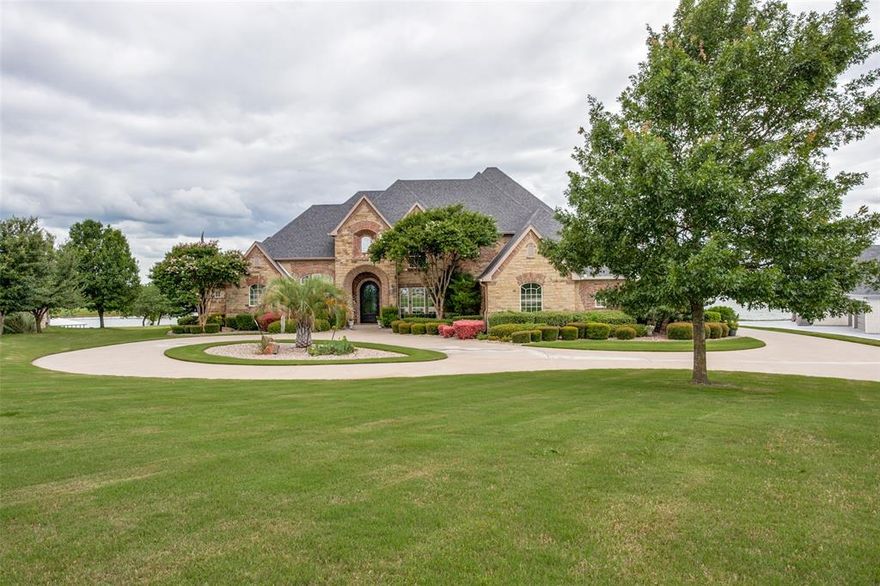 This impressive, lakefront home is located within Crystal Cove Estates and minutes from downtown Waxahachie. Situated on a large 1.53 acre lot with expansive views of Lake Waxahachie, this elegant, family home offers easy entertaining year round. The entryway boasts of two story ceilings and windows facing directly over the pool and patio to the lake beyond. With the primary suite and one additional bedroom on the first floor and two additional bedrooms on the second floor, plus a media room, second living area, and snack bar there is room for everyone. A formal dining room off the grand entry opens to an expansive entertaining space complete with the chef's kitchen and breakfast area where family and friends will gather. A screened in dining porch off the kitchen overlooks the beautiful pool and fire pit. Enjoy this home and serene setting year round, whether dining al fresco, boating on the lake, and relaxing by the pool in the summer, or sharing stories by the fire pit when the Texas heat cools down. Wildlife abounds and the sunsets are spectacular.