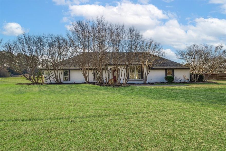 Welcome to 200 Valley View Trl, Double Oak, TX 75077—a beautifully updated 4-bedroom, 3-bathroom ranch-style retreat nestled on 0.9 acres in one of North Texas' most sought-after communities. Offering 2,457 sq. ft. of meticulously designed living space, this home combines modern elegance with timeless charm.

Step inside to find your dream home. The spacious living room boasts vaulted ceilings with exposed wooden beams, a cozy fireplace, and large windows that fill the space with natural light.  The updated kitchen is a chef’s dream, featuring quartz countertops, a brand-new Smart Combi Wall Oven with Fan Convection and built in air-fryer, and a Wi-Fi-enabled QuadWash Pro dishwasher.

The primary suite is a private oasis with backyard views, an oversized layout, and his-and-her en-suite bathrooms, complete with walk-in closets, a spa-like shower, and a soaking tub.

Outside, the covered patio overlooks a sparkling pool and a fenced backyard with mature trees, offering the perfect space for relaxation and entertaining. Additional features include two large storage sheds and a chicken coop. A brand-new roof, two-year-old HVAC system, and a brand-new garage door and opening system provide peace of mind.

Located in the highly desirable Double Oak community, this home offers top-rated schools, a rural feel with urban conveniences, and easy access to shopping, dining, Bridlewood Golf Club, and major highways.

This high-quality, beautifully renovated home is move-in ready and waiting for you! Schedule your private tour today!