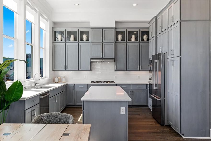 Welcome to Foundry Row, an exclusive collection of 8 townhomes in Fort Worth’s vibrant West 7th District. This elegantly designed residence features an open floorplan with high-end finishes ideal for entertaining. The main level boasts soaring 12-foot ceilings and a 10-foot sliding glass door that seamlessly extends your living space outdoors. The gourmet kitchen is equipped with Bosch stainless steel appliances, quartz countertops, a stylish tile backsplash, and soft-close cabinetry. The serene primary suite includes a large drop-in tub, walk-in shower, and extra spacious closet. Throughout the home, upgraded engineered hardwoods enhance the sophisticated ambiance, while the private rooftop deck offers a quiet retreat with sweeping views of Downtown Fort Worth. Located just minutes from the lively West 7th District, you’ll enjoy convenient access to dining, shopping, museums, entertainment, and more. Experience the perfect blend of luxury and sustainability in this exceptional home. For a limited time, buyers may receive a fixed interest rate as low as 4.99% through one of InTown Homes’ preferred lenders. PLEASE GO TO MODEL HOME FOR ALL OPEN HOUSES - 201 CARROLL ST.