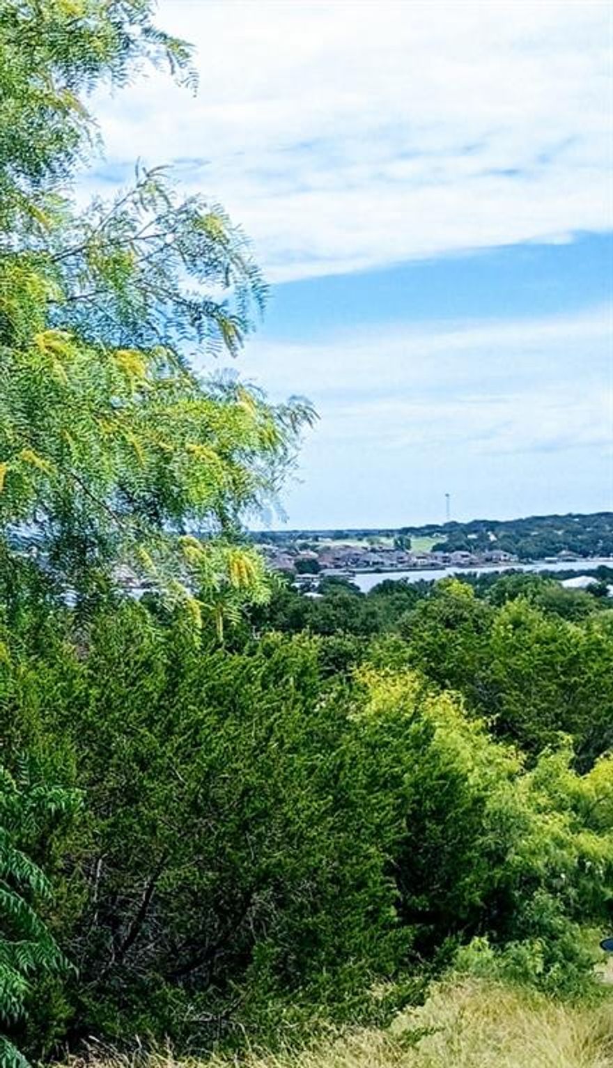 Contact your builder NOW as this coveted, corner Indian Harbor lot is on the market! This site has a perfect location for your dream home. And, from a second floor, you won't believe the views of Lake Granbury! Indian Harbor is a gated community with an HOA that is affordable. Located outside of the city limits providing a lower tax rate and allowing the building process to not be held up by city requirements. Indian Harbor is located close enough to the historic Square for an easy commute to the shopping and restaurants yet, far enough from traffic and noise. Seriously! Bring your house design, meet your builder, and come out to see this lot!