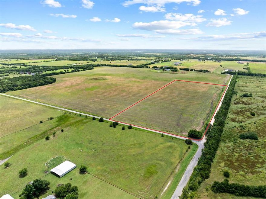 Hard to find 21-acre tract in the highly sought-after Van Alstyne Independent School District, offering over 2,100 feet of combined road frontage. The property boasts approximately 1,480 feet along Sedalia Road (north boundary) and an additional 670 feet along paved Bucksnort Road (east boundary). A 3-inch water line borders the property to the North on Sedalia Road and a 4-inch line borders the property on the East on Bucksnort Road. Power is available from Grayson County Electric Cooperative. Importantly, the tract has no pipelines or floodplain encumbrances and is located outside city limits, providing maximum development flexibility. Grayson County regulations allow septic on half-acre lots, creating excellent potential for higher-density single-family development. The land is currently under an agricultural exemption, offering favorable tax benefits. For larger-scale projects, additional acreage is available—up to 70.59 acres total with more than 4,200 feet of frontage.