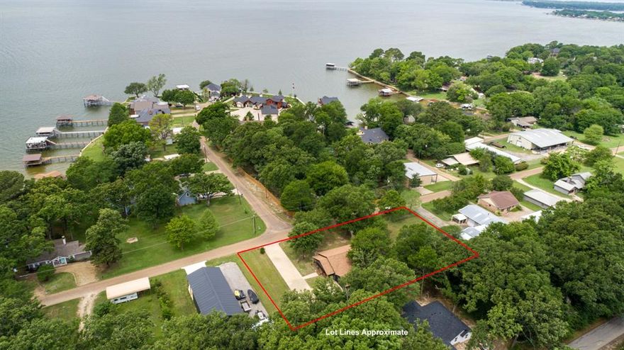 Located near Cedar Creek Lake, this beautifully updated 3-bedroom, 3.5-bathroom home offers lake views and is situated on two lots, providing additional space for outdoor use and flexibility. Each bedroom includes an ensuite bathroom, offering a functional layout for occupants and guests.
The interior features an open-concept kitchen and living area designed for everyday living and gatherings. The kitchen has been fully renovated and reconfigured to create a more open and usable space. An oversized utility room offers the option for a home office, workspace, or additional storage.
Recent updates completed by the current owners include foundation leveling, exterior paint, a renovated kitchen, and the addition of a half bathroom in the garage.
The exterior includes multiple covered porches, mature shade trees, and a concrete driveway with space for multiple vehicles. The property is not subject to an HOA.

Buyer and buyer agent to verify all information.