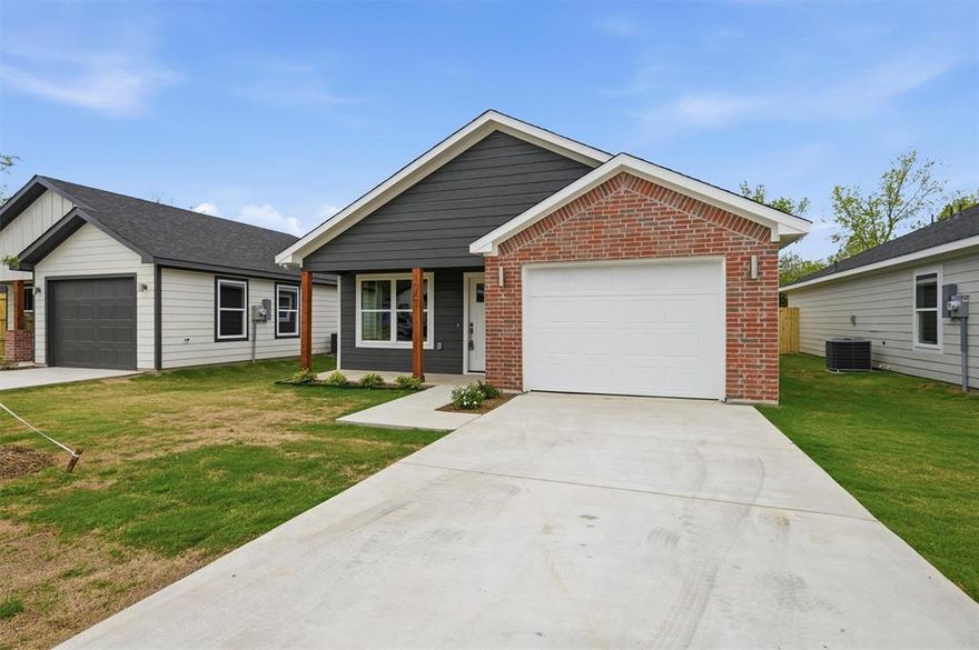 This newly constructed home offers an efficient and thoughtfully designed floor plan which features an open floor plan with two bedrooms and two full bathrooms. The interior features marble countertops, a walk-in pantry, electric oven and stove, microwave, and a utility room with a provided washer and dryer. This home features a one-car garage and covered front porch. The backyard is fully fenced with a wooden privacy fence for your comfort. This home is ideal for low-maintenance, modern living located less than one mile from downtown Sherman.