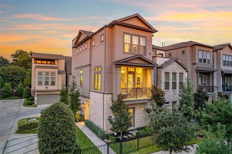 Immaculate three-story home in the sought-after Oak Park community! This beautifully maintained 3-bedroom, 4-bath residence sits on a desirable corner lot with professional landscaping and inviting curb appeal. Enjoy stunning Downtown Dallas views from the rooftop patio, complete with a built-in grill, mini fridge, and plenty of space for entertaining or relaxing. Inside, large windows fill the home with natural light, creating a warm and welcoming atmosphere. The open floor plan allows the dining area to flow effortlessly into the kitchen and spacious living room, making it ideal for everyday living and entertaining. The chef’s kitchen is a true highlight, featuring quartz countertops, white shaker cabinetry with under-cabinet lighting, a large island, subway tile backsplash, designer lighting, and a gas cooktop. Each bedroom offers the privacy of an ensuite bath, while the primary suite boasts two walk-in closets, elegant tile-work, and a luxurious shower with dual shower heads. The first-floor bedroom is perfect for guests or a home office, the two car garage is equipped with ample storage. Residents of Oak Park enjoy fantastic community amenities, including a pool, two dog parks, and front yard maintenance with a low HOA due of $100 per month. Ideally located just steps from West Highland Park and minutes from Dallas North Tollway, the Medical District, and Downtown Dallas, this home perfectly blends comfort, convenience, and style in one of Dallas’s most desirable neighborhoods.