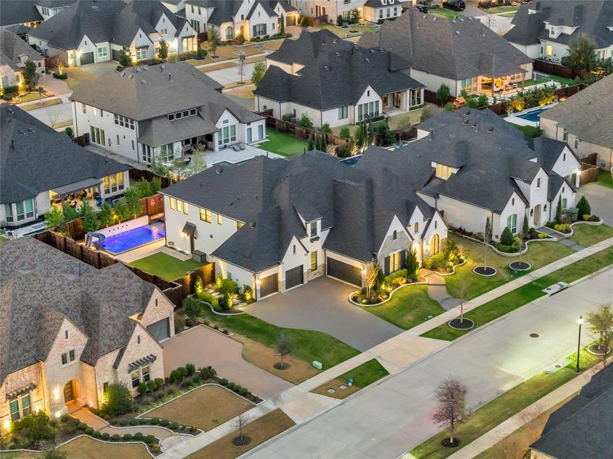 Welcome to luxury living in the highly sought-after Peninsula of Windsong Ranch, one of Prosper’s most desirable communities. Built by award-winning Huntington Homes, this stunning 5,513 sq ft custom home blends timeless design with exceptional indoor and outdoor living.

Featuring 5 spacious bedrooms, 5 full baths, and 3 half baths, this thoughtfully designed floor plan offers room for everyone. The home includes a private office, media room, entertainment or game room, and a dedicated card room, creating the perfect balance of work, relaxation, and entertaining. A 4-car garage provides plenty of space for vehicles and storage.

Step outside to your resort-style backyard oasis, complete with a beautiful pool, spa, fire pit, fire features, turf, and professional landscaping. The pool bath provides convenient access for guests while entertaining outdoors.

Located in the Peninsula section of Windsong Ranch, residents enjoy access to the community’s famous 5-acre crystal lagoon, miles of trails, parks, and resort-style amenities. This particular street is known for its festive holiday spirit and incredible neighbors, creating a true sense of community.

With luxury finishes, exceptional craftsmanship, and one of the best locations in Windsong Ranch, this home offers the perfect combination of elegance, comfort, and lifestyle. Taxes are paid to Denton ISD, but the HOA Education Fund Agreement allows attendance at Prosper ISD.