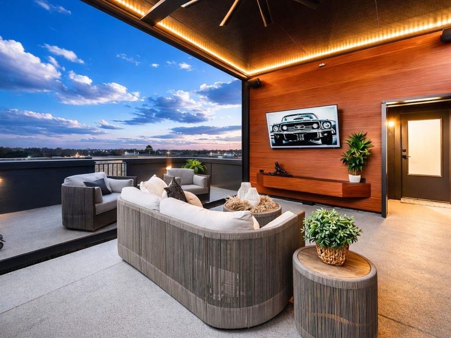 You’ve been searching for a rooftop home in Dallas under $650K with elevated upgrades already in place… and this one delivers. Located in West Dallas near Trinity Groves and just minutes from Downtown Dallas, this fully upgraded Dallas rooftop home offers the private rooftop terrace, smart home features, and move-in ready finish today’s buyers are actively seeking.

The extended rooftop deck is anchored by a custom $40,000 pergola by Cabana Theory, creating a true outdoor living environment rarely found at this price point. Built-in surround sound with karaoke capability and a motorized privacy screen complete this entertainer’s rooftop, positioning it among the more functional rooftop homes currently available in Dallas under $650K.

Inside, the chef’s kitchen features custom cabinetry with soft-close systems, while the designer primary closet build-out, architectural accent wall panels, curated mirror installations, and built-in undercounter ice maker deliver the polished, finished feel buyers want in a move-in ready Dallas home. A custom Murphy bed in the office adds flexible guest space without sacrificing everyday functionality.

What separates this property from typical builder inventory is that the high-value upgrades are already complete. Rather than purchasing a base-level new construction home and investing after closing, buyers here step into a fully enhanced residence positioned in the upper tier of the community.

Long-term value features include a whole-home reverse osmosis water filtration system, Tesla EV charger installation, Vivint smart home security with exterior cameras, and multi-level HVAC controls serving all three floors.

For buyers searching for a Dallas rooftop home near Trinity Groves with EV charging, smart home technology, and true entertainer outdoor space…