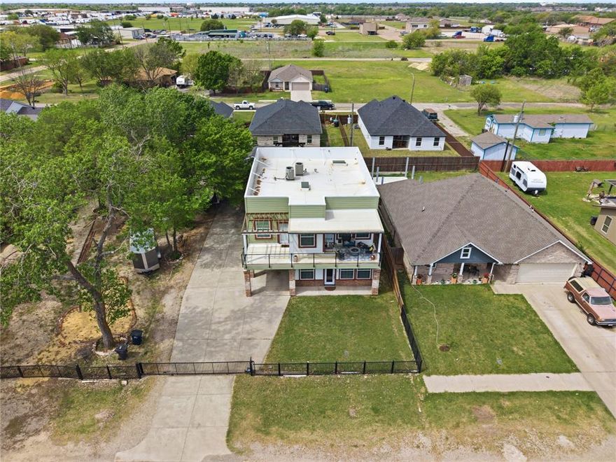 A true showstopper with a modern design and unique features you won't find anywhere else!!
This spacious 5 Bedroom, 4 Full baths offers a great layout, including a media room, office, and a downstairs guest bedroom with a full bath. Open concept living with a large kitchen island, granite countertops, and plenty of space for entertaining. Vinyl and tile flooring throughout-no carpet. The Property also features a detached 2 Car garage with a bonus space currently used as a gym. Several rooms have access to private balconies, perfect for relaxing or enjoying your morning coffee. Built in 2016 with quality materials. Gated Property with an electric gate for added privacy. Located in an area with new construction and continued growth. 
A must see to truly appreciate schedule your showing today!