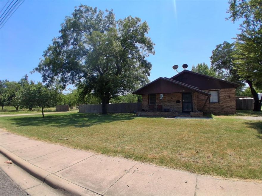 Investor’s Dream! This rare opportunity offers over 5 acres of prime land right in the heart of town on the main highway, in Brownwood’s vibrant Main Street area and minutes from everything the area has to offer. All city utilities are available, making development or expansion a breeze. The property includes a charming 2-bedroom, 1-bath home with central heat and air, a spacious patio, beautiful large shade trees, fruit trees, and a peaceful creek. A heated and cooled shop, along with several other outbuildings, provides endless possibilities for storage, work, or hobbies. With its unbeatable location and versatile features, this property is truly a must-see.