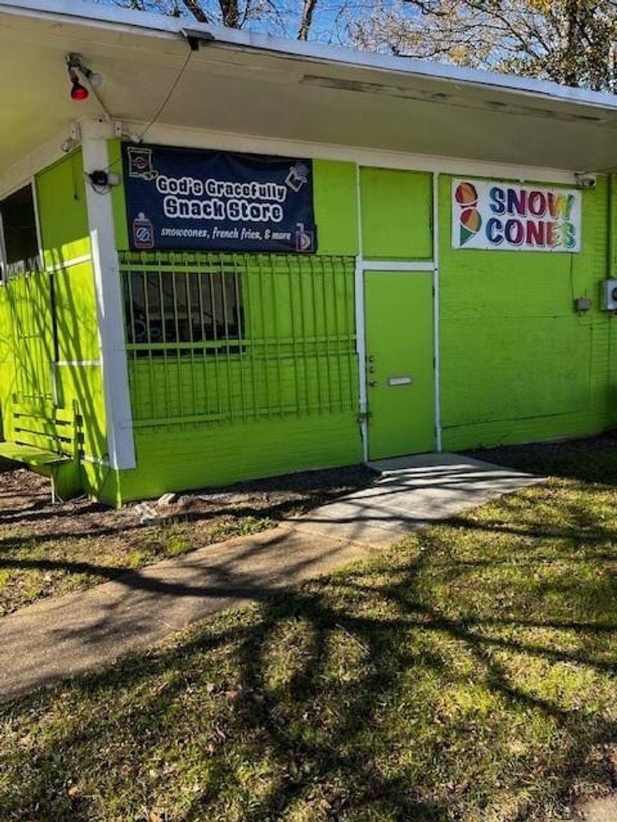 Commercial lot, with 2 buildings, one building is 2354 sq ft as well as 398 sq ft building used as a snack & snow cone store. The other building has concrete flooring, 2 restrooms, kitchen and dining area. Structurally sound Great condition. Conveniently located near the Fairgrounds and Willis Knighton Hospital. Multiple possibilities- restaurant, lounge, whatever you desire with this lot and 2 buildings already operable and ready for immediate use.