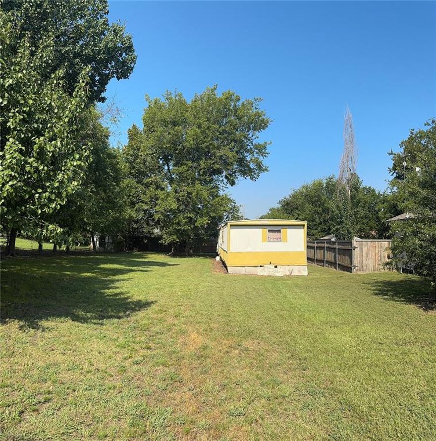 0.207-acre property in central Quinlan with an existing 960 sq ft manufactured home sold as-is. Zoning does not allow replacement with another mobile home. Options include full rehab or demolition and building a new traditional house. Utilities available. Walking distance to schools, shops, and dining. Affordable entry with redevelopment upside—submit your offer!

 Do not enter the mobile home due to unsafe interior conditions.

Buying agent or buyers are responsible for verifying all information independently regarding this property.