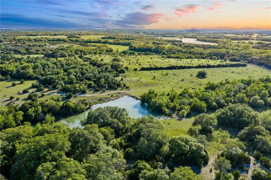 Overview | 
Rare, diverse and sprawling—1505.9+/- acre Reese Ranch in Meridian, TX has been owned and operated for almost a century by the Reese Family.  This premier ranch offers extraordinary landscapes, exciting recreational opportunities, an abundance of wildlife and effortless accessibility throughout the property!

Terrain | 
The topography on this property is diverse and unique with rolling hills, highly elevated peaks and winding creek bottoms.  There are several peaks that offer expansive panoramic views, perfect for a dream home or hunting lodge.  

The land is lush with thousands of mature hardwoods including massive hundred-year-old oak trees, several improved pastures and the perfect amount of wooded-to-open terrain.  The roads and trails throughout the property allow for maximum accessibility of the entire ranch.  

Water | 
The ranch features 7 great sized ponds spread evenly over the property allowing for cross fencing and improvements to be added anywhere you desire.  There are also several creeks that run the length of the property.

Wildlife |

The land offers endless hunting and fishing opportunities including whitetail deer, dove and turkey.  

Location | 
The ranch has over 2 miles of road frontage on a paved road just a few minutes from Downtown Meridian, TX--in the heart of Bosque County.  The ranch is located approximately 1 hour to Waco, Baylor University and Silo District, 1.5 hours to DFW, and 2 hours to Austin. 

Utilities | 
 
There is a brand new water well and 3 electric meters in place.

Enjoy the AG exemption that makes the taxes approximately $3500 if the exemption stays in place!