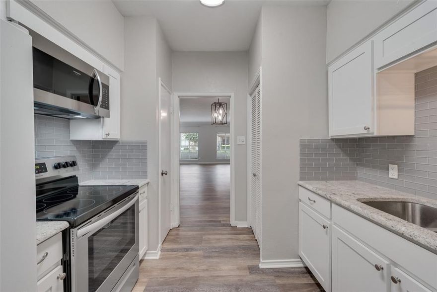 Beautifully remodeled downstairs condo in the Tanglewood area of Fort Worth near TCU.  Beautiful downstairs location overlooking sparkling pool.  How would you like to spend the Summer just a few steps from the pretty pool? Enjoy your morning coffee poolside! Completely remodeled in 2022 with new paint, new luxury plank vinyl flooring, all new fixtures, and new carpet.  Kitchen was completely remodeled with new custom cabinet doors, new granite countertops, new sink and faucet, all new hardware and luxury vinyl plank flooring. Built in stainless steel microwave and stainless steel 5 burner range.  Fridge, and washer and dryer stay!  Very nicely updated  with upscale finishes throughout.  Light, bright and beautiful with front living room windows overlooking swimming pool. Pretty, gated community with covered carport space.  Pretty and private covered back porch is perfect for having your morning coffee or afternoon iced tea!  Great location close to shopping, restaurants and a pretty park with walking trails just a block away! Royale Orleans is a lovely community with pretty patio spaces for relaxing.  Water and electric are paid!