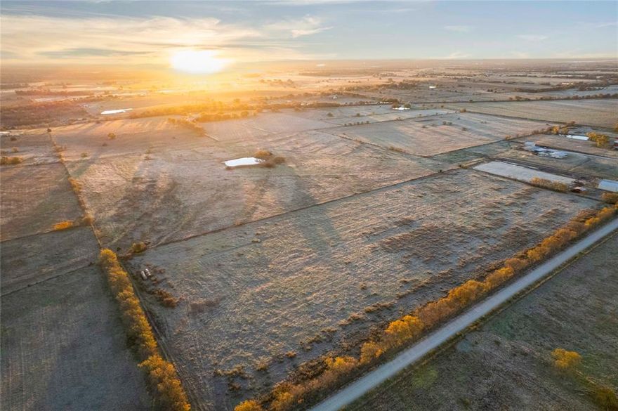 This 13.5 acre property in Cooke County offers a combination of open land, accessibility, and flexibility for rural living or agricultural use. Located approximately 6 miles from downtown Gainesville and 2 miles from Interstate 35, the tract provides convenient access to nearby services and travel routes while maintaining a rural setting.

The land includes approximately 400 feet of county road frontage, offering direct access for future improvements. Electricity is available along the county road. According to available mapping, the property contains no floodplain. There are no restrictions, allowing for a range of potential uses according to county guidelines. A small pond is located on the property, contributing to agricultural or recreational utility.

The acreage is suited for a homesite, hobby farm, or continued agricultural operation. An active agricultural exemption is in place, which may help reduce property taxes for qualifying land use. Open terrain offers space for future improvements such as fencing, barns, or livestock areas.

The property’s location allows access to regional amenities. Highway 82 is approximately 10 miles away, and Lake Ray Roberts is about 30 minutes from the property, offering public fishing, hunting, and boating opportunities. The area reflects a mix of rural character and expanding interest in acreage tracts in North Texas.

This tract provides an option for those seeking land with open space, road access, available utilities, and agricultural potential. Additional contiguous acreage is available for buyers seeking a larger parcel. Buyer to verify all information.