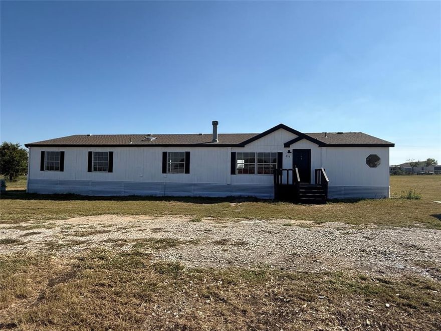 Rare huge Texas size manufactured home 2432 SF with 4 large bedrooms, 3 full bathrooms, 2 living rooms and an office! Plenty of space for the whole family! Sitting on a extra large 1.5 acres of land in Northwest ISD. Fully updated including fresh paint exterior and interior, 2 brand new HVAC systems, new laminate floors and carpets, new quartz counter tops in kitchen and new vanities in bath rooms, plumbing under the house is all new. Storage unit in the back. It's got all the extras you need for easy living. Move-in ready! Last touchups will be completed in the next few days.