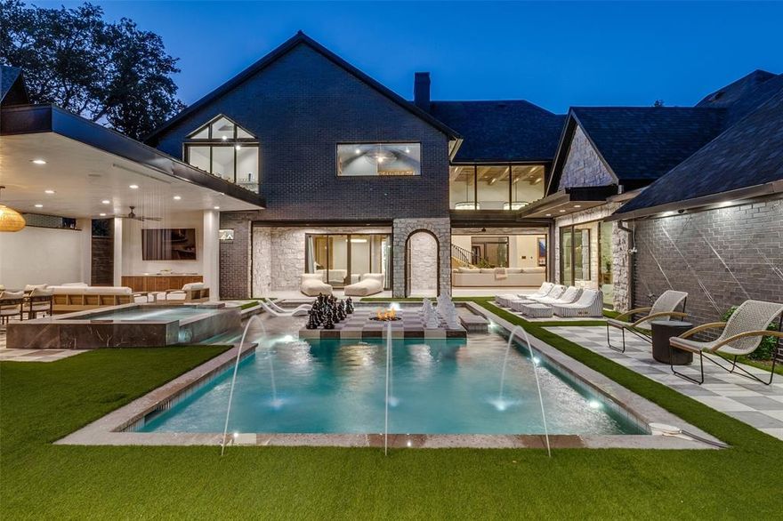 Over 6,000 square feet of designer living space meticulously completed upgrades finished in 2025 with 5,350 sqft in the main house and 700 sqft in the back to make a total of 6,047 sqft of living space! This well designed home is an impossible find and truly one of a kind. Architecturally striking with a modern European aesthetic, this estate blends timeless design with an insane level of craftsmanship and upgrades you simply will not find anywhere else in Dallas. Elegant Venetian plaster walls, RH chandeliers, soaring 20-foot ceilings, custom stonework, reclaimed wood ceiling details, and artisan Zellige tile create a warm yet elevated feel throughout the entire home. The kitchen is an absolute showpiece featuring dramatic marble surfaces, custom cabinetry, designer lighting, and luxury finishes that carry consistently throughout every space in the house. The outdoor living experience feels more like a private resort than a backyard. A stunning pavilion with lounge areas, an outdoor kitchen, and a pizza oven that overlooks the heated pool, creating the perfect setup for entertaining. One of the biggest differentiators of this property is the pool house and guest retreat complete with its own full bathroom, golf simulator, and additional flex space ideal for an office, gym, or studio. Most homes in this price range simply give you more bedrooms you don’t need. This home gives you a completely separate, high-end space you’ll actually use. Whether it becomes a private office, guest suite, or entertainment retreat, it adds a level of functionality and flexibility that is extremely hard to find. Every inch of this home was intentionally designed and heavily upgraded to create something elevated, custom, and genuinely unforgettable. The home itself has 5 bedrooms, a family room that could be an office or a 6th bedroom, and an additional room being used as a gym. The house has 3 full bathrooms and 2 half bathrooms with the 4th full bathroom located in the pool house.