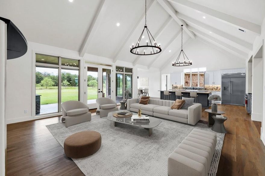 Seller is offering a $25,000 Credit to Buyer with acceptable offer to be used towards closing costs or interest rate buy down.  Rockwall County’s hidden gem—an exceptional custom estate in a gated community surrounded by conservation land. Set on a beautifully landscaped 1.5 acre lot, this home offers 4 spacious bedrooms each with walk-in closets, 3 living areas, and a private office that can serve as a 5th bedroom. Soaring ceilings, hand-textured walls, and elegant finishes throughout. The chef’s kitchen features professional grade Monogram appliances, including a 48 inch built-in fridge, 6-burner dual fuel range with double ovens, dual dishwashers, warming drawer, microwave drawer, and custom granite countertops.
The private primary suite includes crown molding, cove lighting, a decorative window seat, and a luxurious bath with dual vanities, makeup counter, soaking tub, and walk-in shower with dual shower heads. A wine room with handcrafted oak racks, wine refrigerator and ambient lighting adds sophistication. Outdoor living includes a full kitchen with a Blaze 40 inch grill, granite counters, sink, fridge, covered patio, and 600 sq ft of outdoor entertaining space.
Engineered for efficiency: Tella Firma foundation (63 piers), R-60 attic insulation, poly-sealed windows and doors, Owens Corning roof with radiant barrier, ZIP board structural panels, and 500-gal buried propane tank. Extras: 1,000 sq ft 3 car garage, dual driveways, full sprinkler system, termite-treated framing, and septic.  Located in a peaceful setting yet close to local amenities, this luxury estate offers the perfect combination of privacy, elegance, and convenience.