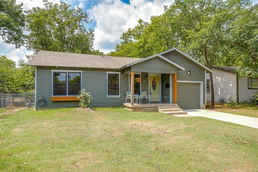 Welcome to your new home in the heart of Arlington! This delightful 2-bedroom, 1-bathroom residence offers a perfect blend of comfort and style, making it an ideal choice for anyone seeking a cozy living space. Begin your days with a cup of coffee on the charming front porch, providing a warm and welcoming entryway to your home. Beautiful wood flooring runs throughout the home, adding a touch of elegance and making maintenance a breeze. The spacious living room serves as the heart of the home, featuring a freestanding fireplace that adds character and warmth to the space. It seamlessly flows into the dining area and kitchen, creating an open and inviting atmosphere. The kitchen is equipped with sleek granite countertops and an abundance of cabinet space, perfect for all your culinary needs. An eat-in kitchen area provides a convenient spot for casual meals. Just off the living room, discover a versatile bonus space. Whether you need an office, playroom, or extra storage, this room offers endless possibilities to suit your lifestyle. Both bedrooms are well-sized, each featuring a closet for ample storage. They offer a peaceful retreat and are perfect for relaxation after a long day.  The bedrooms share a full bathroom, thoughtfully designed to accommodate your daily routines. Step outside to a generous backyard, providing plenty of space for outdoor activities, gardening, or simply enjoying the fresh air. This Arlington gem is a wonderful opportunity for those seeking a comfortable and stylish living environment. Don't miss your chance to make this house your home!