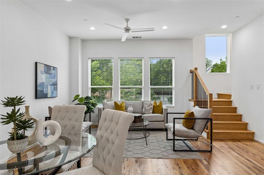 Tucked into one of East Dallas’ most connected pockets, 5647 Live Oak delivers low-maintenance luxury just minutes from Lakewood and Lower Greenville. This three-story townhome-style condo lives larger than expected, with real hardwood floors and abundant natural light throughout. The designer kitchen pairs quartz counters, stainless steel appliances, and ample built-ins with an open, functional layout. Both bedrooms are generously sized, each with a designer ensuite bath, large custom closet, and vaulted ceilings that add volume and light. The first-floor office offers flexible space for work, fitness, or a second living area. Storage is thoughtfully integrated throughout, including custom closet systems and a spacious garage with additional storage. A fenced front yard and secured pedestrian gate provide privacy and convenience. Lock-and-leave living without compromise—modern, efficient, and ideally located. One of 5 available units.