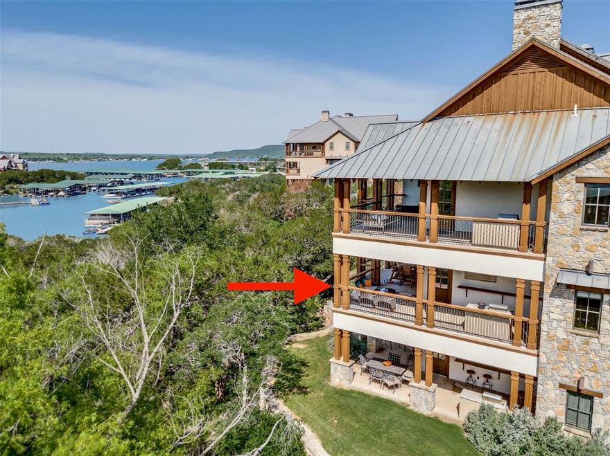 Experience the lake life in luxury at The Harbor at Possum Kingdom Lake where refined design meets resort style living. This turnkey, fully furnished 3 bedroom, 2.5 bath second floor lakeview condo offers panoramic water views, sophisticated finishes, and access to one of the most prestigious gated communities on Possum Kingdom Lake. Designed for effortless entertaining and maintenance free living, the open concept space features rich wood flooring and trim, a stone fireplace, and a striking wood paneled ceiling that adds architectural depth and warmth. Expansive windows frame tranquil water vistas and fill the home with natural light. The gourmet kitchen blends beauty and function with granite countertops, custom cabinetry with lighted glass display doors, a spacious island with bar seating, wine fridge, walk in pantry, and abundant storage. The primary suite is a private retreat with a picture window overlooking the lake and a spa inspired bath offering a garden tub, oversized walk in shower, dual vanities, and a custom walk in closet. Two additional bedrooms provide comfortable space for family and guests, supported by a full bath and convenient half bath. The expansive private patio is an outdoor living experience of its own, complete with built in grill, bar seating, dining area, and room to unwind while enjoying spectacular sunsets and the relaxed pace of lake living. Ownership at The Harbor includes a multi level pool with waterfalls and hot tubs, fitness center and spa, tennis and pickleball courts, sand volleyball, putting green, fishing pond, firepit, and beautifully landscaped grounds. With lock and leave convenience and close proximity to boating, fishing, and waterfront recreation, this condo is ideal as a second home, weekend retreat, or full time lake residence at Possum Kingdom Lake.