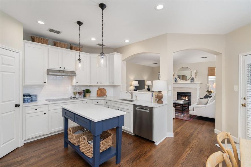 Beautiful two-story home on an oversized lot in Watters Crossing. Impeccably maintained with many upgrades inside. The oversized backyard has plenty of room for a pool and more with mature trees offering shade and privacy. Stunning hardwood floors are on most of the bottom floor. Fresh interior paint throughout. Plantation shutters, modern updated lighting. Stacked formals off of the entry. Kitchen has been totally remodeled with new cabinets, island, quartz countertops, tile backsplash,lighting  and stainless steel appliances. The kitchen is open to the breakfast nook and family room. The focal point of the family room is the fireplace with gas logs. Study is located downstairs with a wall of built-in shelves, cabinets and desk. Double doors leads you into the primary bedroom ithat is spacious and features a vaulted ceiling and ceiling fan. The light and bright bath has a large jacuzzi tub, separate shower and two vanities. Updated lighting, faucets and mirrors. Three more bedrooms upstairs.