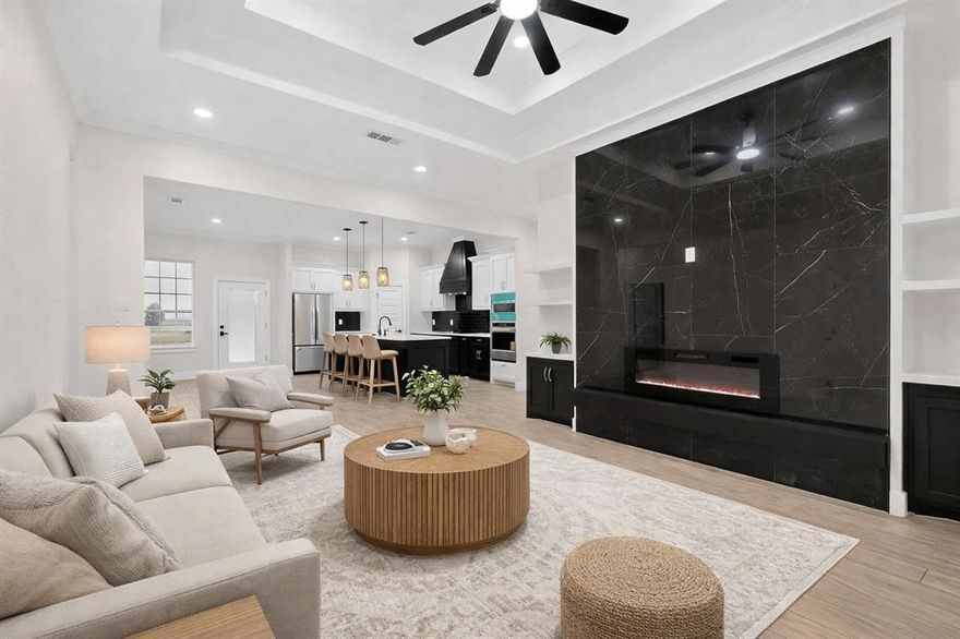 Stunning 3-bedroom, 2.5 bath modern farmhouse new construction. Featuring board-and-batten siding with stone accents and a welcoming covered entry, this home blends timeless curb appeal with contemporary luxury. Close to Cedar Creek Lake with easy access to nearby marinas and boat ramps, enjoy lake life just minutes away. Inside, enjoy a bright open-concept layout with designer finishes throughout, including two-tone cabinetry, quartz countertops, a bold black subway tile backsplash, matte black fixtures, and built-in stainless appliances. The spacious living area is anchored by a breathtaking floor-to-ceiling fireplace feature wall, creating the perfect statement centerpiece for entertaining or relaxing. The private primary suite includes a large walk-in closet and spa-inspired bath with dual vanities and modern finishes. Two additional bedrooms provide flexibility for guests, family, or a home office. Complete with a 2-car garage and modern craftsmanship throughout this home is the perfect blend of farmhouse charm and upscale design.