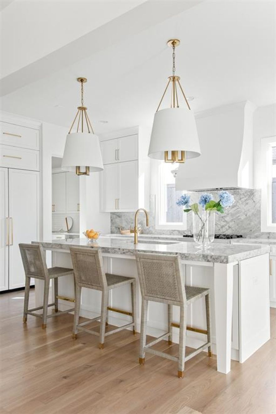 Classic, timeless, and ideally positioned on a picturesque street in the 4000 block, discover this dream home by Jessica Koltun Home. The blend of modern architecture and transitional finishes evokes warmth while understated elegance remains constant throughout this Midway Hollow masterpiece. Countless custom features and finishes include museum-quality walls, panelled fireplace wall, reeded cabinetry, stately millwork, and white oak wood floors with custom  patterns. First-floor amenities include a dedicated study, a formal and casual dining room, and a private primary suite that has direct access to the laundry room. The second floor features four bedrooms, three bathrooms, and an oversized game room that could also be used as a sixth bedroom. This is your opportunity to own a designer dream home