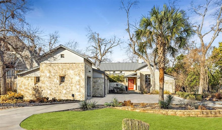 An art collectors dream! This single-story contemporary home has clean lines with a cozy home with a warm welcome. Situated on a private street with a .61 acre lot in N Dallas. Striking floor-to-ceiling windows throughout the home without compromising privacy from the street. Just over 6300 sq ft of living space & 14 ft ceilings with a split floorplan creating seclusion for everyone. The primary suite & guest bedrooms are located on opposite ends of the property. Perfect for entertaining with a chef’s kitchen including Viking 48-inch gas cooking range & griddle, double Viking ovens, oversized Viking wine fridge & industrial built-in refrigerator & freezer. Plenty of space for living with a media room, living area, formal dining & dual desk study. Outside space surrounds the home with a large lot including a courtyard, dog run, circle drive, pool, hot tub, outdoor kitchen & green space. Additional storage in the 3 car garage with built in cabinets, a dog room, and epoxy flooring.