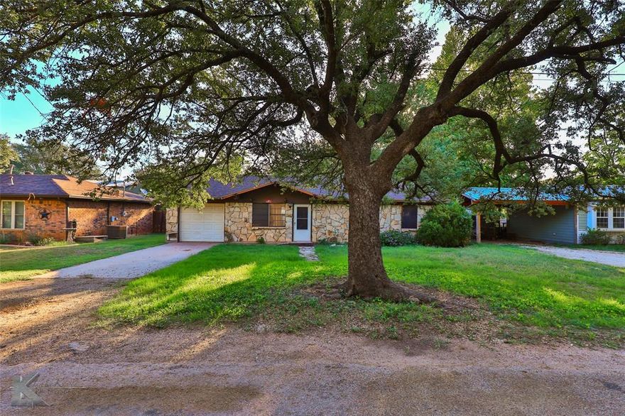 This Charming stone house situated in the historic Buffalo Gap community offers endless opportunities. This three-bedroom, one and a half bath, is perfect for a starter home or an investment property!  Peaceful living awaits on this tranquil tree-lined street with an old country feel. Escape the city life and transform this gem into your own, located in the highly sought after Jim Ned school district. Spacious living opens to a cozy dining area with a sliding glass door, providing tons of natural light. Large kitchen boasts ample cabinets and separate pantry. Single car garage off the kitchen. Spacious primary complete with a half bath that leads to the utility room. Enjoy the evenings outback with tons of room to play and entertain.