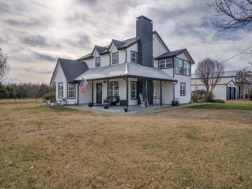 Welcome to a truly one-of-a-kind Modern Farmhouse on 5 acres where wide-open Texas country skies meet refined design & everyday convenience! Tucked behind an automated gated entrance, this amazing property is just minutes from city amenities like shopping, dining, & schools. The crisp white-and-black farmhouse provides a nice welcome as you enter the gate. The home's large covered front porch with café lights creates a magazine-worthy setting for relaxed evenings, gatherings with friends, or morning coffee as the sun rises over the front of your 5 acres. Inside, soaring ceilings & a cozy fireplace anchor the living room, while the open-concept kitchen & dining area shine with granite countertops, white cabinetry, stainless steel appliances, & walls of windows overlooking the property. The private primary suite is tucked into its own wing toward the back of the home & features a fully remodeled spa-style bath with dual vanities & an oversized multi-head walk-in shower. Upstairs offers additional bedrooms, a full bath, & a sun-filled office or sunroom with peaceful acreage views that is sure to make working from home feel like a retreat! So many thoughtful upgrades have already been made too, such as luxury vinyl plank flooring, fresh paint, barn doors, & newish AC, water heater, plumbing, & ductwork, helping ensure peace of mind. Outside though is where this property truly shines! There's a two-car garage, a 20-foot driveway, & an impressive 4,200-square-foot workshop with a half bath. Whether you’re a car collector, entrepreneur, or hobbyist, this space provides endless possibilities, inc running a home business (zero commute!). And if business isn’t on the agenda, the warehouse-style space is perfect for storing boats, RVs, equipment, etc, so the property is practical AND impressive! With acreage, modern farmhouse design, and unmatched utility, this rare property offers privacy, flexibility, and a peaceful country lifestyle. Note: FOUR acres are AG Exempt too!