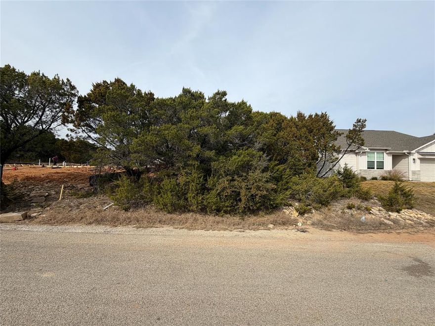 This lot offers a great opportunity to build your custom home in an established, well maintained community. Water is available at the street, and a septic system will be required. Located just minutes from shopping, dining, and the charm of downtown Granbury and in the highly sought after community of Canyon Creek. This gated subdivision is well established and offers a variety of amenities, such as 2 pools, playground, lake access, clubhouse. The seller has a survey available. Call today to secure this amazing lot!