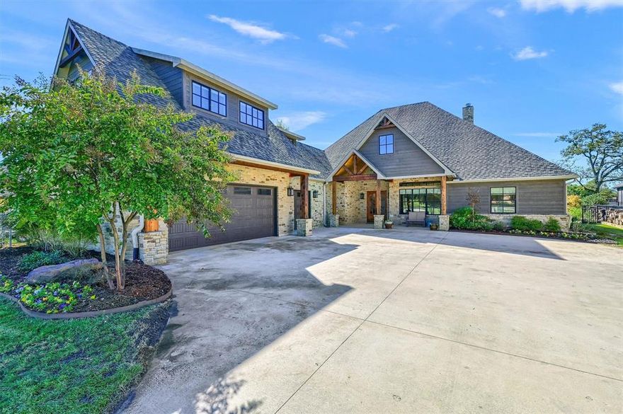 This lakefront estate embodies the pinnacle of luxury living with unparalleled attention to detail. Spanning over 3,846 sqft, this meticulously designed home offers 4 spacious bedrooms, each accompanied by its own ensuite bathroom, and 4 and a half opulent baths. From the moment you step inside, the soaring vaulted ceilings and expansive windows flood the home with natural light, framing breathtaking panoramic views of the lake. The heart of the home is an awe-inspiring living room with stone fireplace that seamlessly flows into an entertainer’s dream kitchen, featuring a stunning wood accent ceiling, a massive kitchen island perfect for gatherings, and a walk-in butlers pantry. This space is as functional as it is beautiful. Adjacent, a wine room offers the perfect retreat for connoisseurs to showcase their collection. The thoughtful design continues with a sophisticated home office, also boasting vaulted ceilings, ideal for those who work from home or seek a private space for reflection. The primary suite is a sanctuary, offering tranquil lake views, a spa-like bathroom with a luxurious walk-in shower, separate soaking tub, and dual vanities. A custom walk-through closet leads directly into an expansive laundry room, ensuring effortless convenience. Upstairs the bonus room provides ample space for play or relaxation, and an additional bedroom and full bath. Step outside to your private resort, where an inviting swimming pool, hot tub, and stunning waterfall feature create the perfect backdrop for relaxation or entertaining. The screened porch with a cozy fireplace and outdoor kitchen invites year-round enjoyment. The newly built boat dock, featuring cedar accents and a PVC seawall, completes this idyllic lakefront retreat. 3 car garage and large driveway provide plenty of parking. Impeccable craftsmanship and a refined aesthetic throughout make this property not just a home, but the ultimate in elevated living.