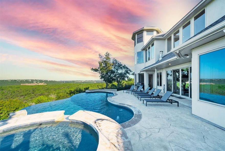 Welcome to your dream home in Westcliff. Luxurious 2-story home on a 3-acre lot at the end of a cul-de-sac with unparalleled views & privacy. 4K sqft home features expansive living spaces: large living area, formal dining room, study, & gourmet kitchen with Stainless KitchenAid appliances. Main floor includes primary bedroom & an en-suite guest bedroom. Upstairs: optional 4th bedroom with full bath, serving as a game room or flex room, along with an additional bedroom & bathroom. Home boasts 4 bedrooms & 4.5 bathrooms, ideal for both daily living & entertaining. Natural light floods main-level living room, open to kitchen, with seamless indoor-outdoor flow to pool & outdoor living. Spiral staircase leads to observatory with panoramic views. Property backs to nature preserve for peace & seclusion. Recent updates: new roof, whole-house RO system, surge protector. 10 min. from Emma Long Metro. Park & 15 min. from downtown Austin, offering both luxury living & short-term rental potential.