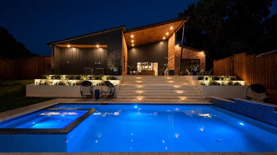 With 4,100 total SF (main home + guesthouse) of single-story new construction, this warm contemporary home (with a nod to its MCM ancestors) is ready for its first caretaker - the kind of person who wants their home to feel like a year-round retreat, grounded by natural light & incredible views.

Don’t miss the ultra-rare 1,186 SF guesthouse, steps from the resort-style pool, spa, & 500+ SF outdoor terrace, spanning a .41-acre corner lot. Perfect for multi-gen living, entertaining, WFH, or staycation vibes year-round.

Entertain with ease from the 20’ covered terrace, built-in gas BBQ, & outdoor refrigeration, all overlooking the stunning pool & spa.

Additional highlights include an 843 SF 3-car garage with side-mount Chamberlain openers, EV charger, Navien tankless water heater, & whole-home water filter. Outside you'll find custom corten steel planters, tiered concrete hardscapes, & drought-tolerant landscaping.

Tucked privately in the rear of the home, the primary suite features its own terrace, soaking tub, & custom walk-in closet.  Wake up to a spectacular view and direct access to the pool. A spacious secondary suite offers ideal flexibility.

Even the laundry room was thoughtfully designed with direct access to a separate fenced yard, DUAL stackable washer-dryer connections, and abundant storage.  The butler's pantry is plumbed for a secondary fridge.

Enjoy RISD schools & proximity to private schools, Northwood Country Club, and White Rock Trailhead. Quick access to 75, Coit, 635, & the Tollway.

If you want the quality & thoughtful detail of a custom home without the hassle or the wait, come experience this special property.

*MLS does not include guesthouse SF in price per SF.  Actual PPSF is $475 and doesn't take into account the .41 acre corner lot, extensive hardscaping & landscaping, new privacy fence, site-wide drainage, 843 SF 3-car garage, 500+ SF covered patio, pool, or hot tub, all backed by a 10 year third-party warranty.*