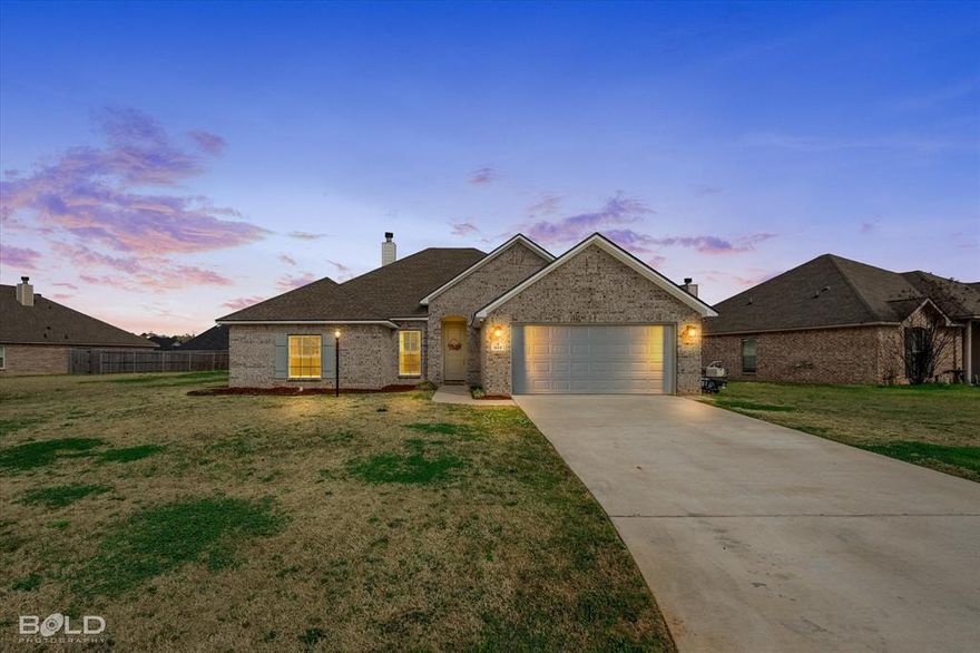 This stunning residence offers the perfect blend of modern design, functionality and comfort. This open floor plan offers a desirable split bedroom plan featuring 4 spacious bedroom and 2 inviting baths. Designed to meet your every need,  the spacious living room features crown molding ,cased windows that allow for abundant natural light, a fireplace  and great built in book cases for displaying all your favorite photos and collections.  The gourmet kitchen includes a gas range, upgraded cabinet hardware, stainless steel appliances, granite counter tops and plenty of cabinet space to make meal prep a breeze. The remote primary suite is the perfect place to relax after a busy day with its generous size and spa-like ensuite bathroom offering dual vanities, dual walk in closets, a large tiled walk in shower and an inviting soaking tub.   Enjoy outdoor living with a large covered patio, a private fully fenced backyard perfect for BBQs, gardening, or just relaxing.  This home is located in a desirable subdivision just minutes away from Schools, Interstates, Playgrounds, Library and Shopping.