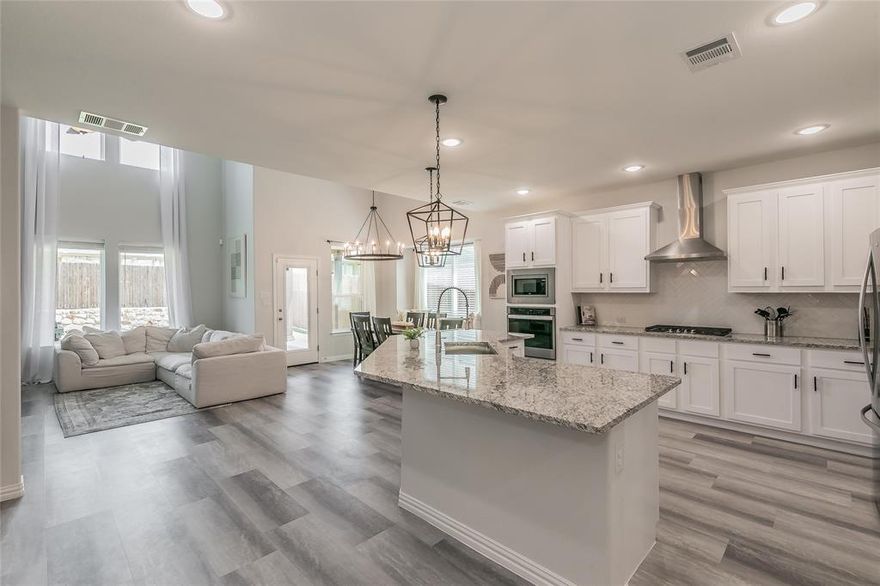 This is the one you have been searching for! Yes you read that right, this home is over 2600 square feet priced under $440k. As you enter thru the front door your eyes are drawn to the large windows in the rear of the home that cover the first and second floor wall. Walking straight ahead down the hall you enter the main area that opens up to the chefs kitchen and 2 story living and dining space. The owner has recently replaced the lighting in the kitchen and dining area. The master is very large and features beautiful windows that allow lots of light. The master bath that has dual sinks, large garden tub and separate shower. This home has walk in closets in every room and multiple storage areas. Upstairs had 2 bedrooms, a jack and jill bathroom plus a huge game room or additional living space. The backyard features a large covered patio. This community has a wonderful amenity center with a fitness center, large pool and lots more! Come see the house and make it your forever home!