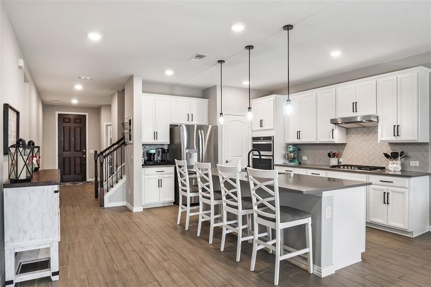 Welcome home to your like-new, move-in ready, single owner residence on a prime lot near the amenities center, in the sought-after Pecan Square community of Northlake, TX! This 4-bedroom, 2.5-bath home features a private home office, two living areas, and a spacious floor plan designed for modern living.

The open-concept main floor seamlessly connects the living, dining, and kitchen spaces — perfect for everyday living and entertaining. An entertainer’s dream, the kitchen showcases stainless steel appliances, a gas range, a large center island with ample prep and gathering space. After hosting friends and family, unwind in the private primary suite located at the rear of the home, complete with dual sinks, an oversized shower, and a spacious walk-in closet.

A dedicated office near the front entry provides privacy and flexibility for working from home, studying, or managing daily tasks, that could also double as a guest space. Upstairs, you’ll find three generously sized secondary bedrooms, a full bath, and a versatile second living area or game room ideal for movie nights, play space, or hobbies.

Residents of the award-winning Hillwood master-planned community, Pecan Square, enjoy resort-style amenities including pools with splash areas, a fitness center, community gathering spaces, pickleball courts, and an arena perfect for pick-up basketball games or neighborhood events. Conveniently located near major highways, shopping, and dining, this meticulously maintained home offers comfort, flexibility, and exceptional community living. Also less than 5 minutes from the new grocery store opening the 1st week of March! New middle school coming - Fall 2026!