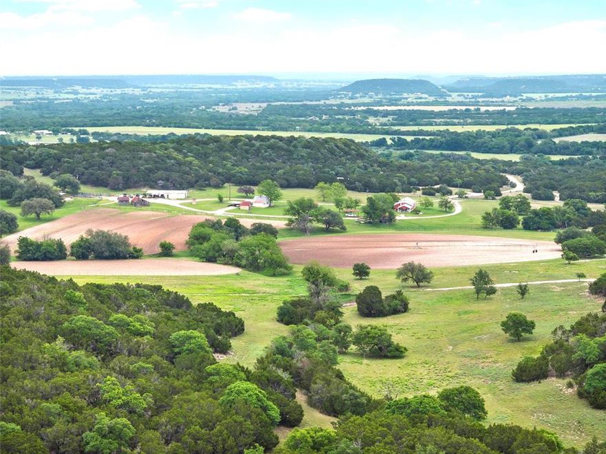 Located in the highly desired Norse Historic District of Bosque County. The farm is characterized by dramatic elevation changes, box canyons, rock outcroppings, native grasses, cultivation and good surface water. The land is characterized by plentiful mature trees, various types of natural grasses, and numerous seasonal springs.  Two ponds and one seasonal pond create adequate surface water for livestock and wildlife.  The elevation ranges an impressive 120 ft. The homestead consists of 2 small houses, a livestock barn, a shop building with an office, cultivated ground, and numerous examples of hand constructed historic buildings and features.  One of the most unique features on the farm is a historic native limestone cabin.  The rock walls and fireplace and axe-hewn rafters provide an amazing glimpse into the local history and craftsmanship.  Other unique features include the hand-crafted masonry water storage tank, the hand-constructed rock retaining walls near the houses, and the stacked rock retaining wall along the livestock pens.  There are also several small wooden barn structures. The first home is a 2BR 2B turn-of-the-century frame house, originally built as a parsonage and relocated to this farm.  The 2nd home, referred to as the Ellingson Farmhouse, is a 2BR 1.5B home that is documented in the Bosque Historic Register as well as the National Historic Registry.  Other improvements include a metal horse barn with stalls and a 30x72 metal shop building with attached 30x16 farm office that has electricity, water, and covered equipment parking.  The 15-acres of cultivated ground are used to grow alfalfa, wheat, oats, and other crops.  The farm is currently used to raise big horned Dall sheep and quail, and the property includes a set of pipe working pens.  The farm is fenced for livestock.  The Seller believes they own 100% of the minerals which will convey with a full price offer.