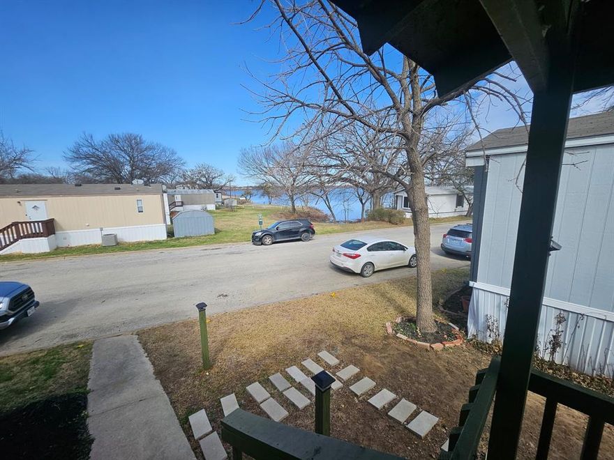 Step off front porch and walk right up to Lake Arlington and go fishing!
Property located 200 ft from lake Arlington inside of El Largo II. Single wide has been fully updated inside.
Comes on a rented lot that is $775 per month.
Current tenant in the property and wants to stay. Current rent $1,450 per month