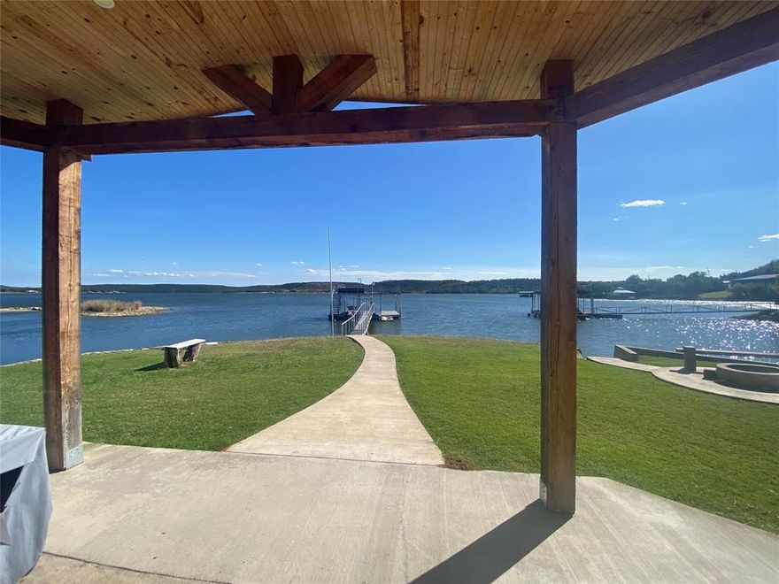 Large Private Fishing Pond on this PK Waterfront 4 Bed - 3 Full Bath fully renovated & fully furnished home on 1.168 acres with HUGE views! Prime+ location, Deeded, Level Lot on the coveted West Side of PK! 2 Story Boat Dock rebuilt in 2024 with rope swing off the top!
Beautiful rustic modern Concrete floors downstairs are perfect for Lake Life & Luxury Vinyl Plank upstairs! Quartz & Granite countertops throughout! 2 Dryers, 2 Refrigerators, Sleeps 20+ people in Beds if needed!
Certainly one of the most desirable properties at Possum Kingdom - to be 1+ acres plus a private fishing pond on a flat lot, with over 300 feet of PK Water frontage!
This has been a wildly popular and successful Vacation Rental Property at PK, and cherished by the owners. At the Private Pond, make memories fishing on the dock or take out the canoe or peddleboat to find plenty of stocked bass, crappie, bluegill, catfish, and wildlife of all kinds!
Oversized Metal Double Garage accommodates boats, jetskis, and lake toys. Vintage Steel Trolley House right on the water would make an incredible man-cave, outdoor kitchen, or party barn. 
Lots of room for parking AND an incredible large level grassy area, sprinkler system on a permitted Lake Pump! Plenty of flat land for additional structures to be built. 
New boat lift on dock will be installed in November!