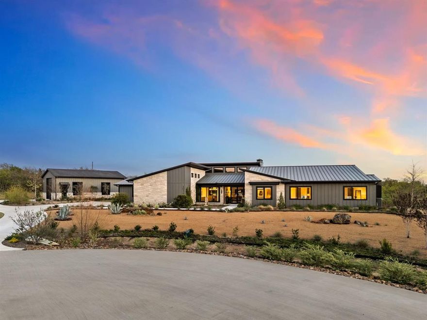 Tucked away on a coveted corner lot in Trifecta Estates, lies this modern ranch gem. One story open-concept, seamless living flows across the large family area and 4 spacious bedrooms. Professionally curated, this home boasts many one-of-a-kind touches: from custom 21’ family area ceilings, to one-of-a-kind Arteriors light fixtures, hand-made flooring, a complete Miele kitchen package, plenty of space for art, no detail is overlooked. With a designated office, exercise space, completely enclosed patio - ideal for a dog run, aviary or private garden, and a variety of outdoor living space. The peaceful and private back yard features a pond, an RV Barn and workshop storage space, and chicken enclosure. With no other residential development on the rear of the property, it offers southern exposure to an equestrian center with horses grazing at the fenced property line. Truly unlike anything else on the local market, this home offers unparalleled style and serenity with move-in ready convenience.