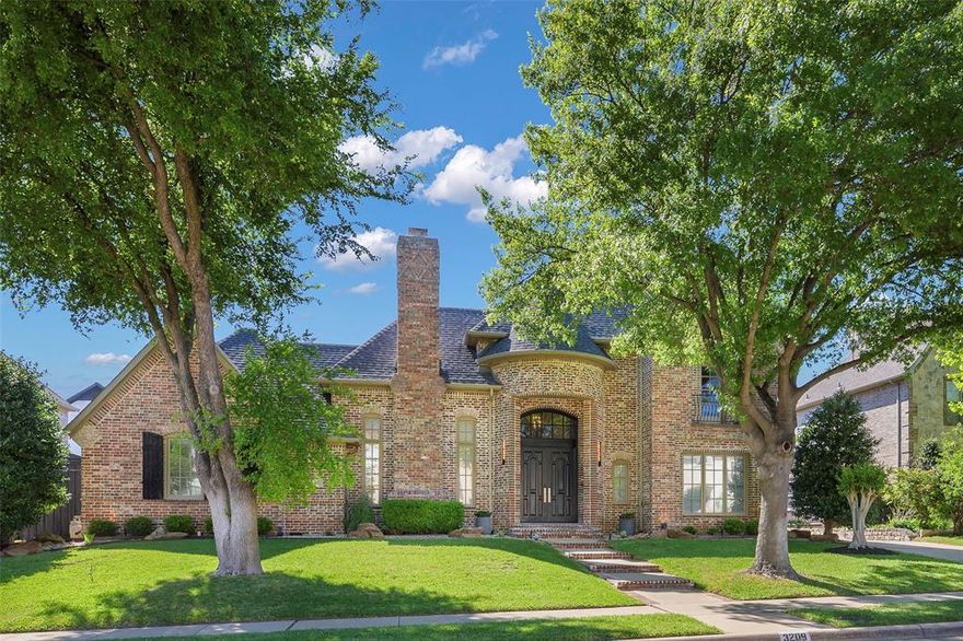 Nestled in the prestigious Creeks of Willow Bend and located just moments from the Gleneagles Queens course, this beautifully appointed traditional residence exudes timeless elegance and meticulous care. The grand entry makes an immediate impression with soaring ceilings, rich travertine flooring, and exquisite moldings that flow throughout the home’s open and airy floor plan. To one side, a stately living room anchored by a stone fireplace offers a warm welcome, while the adjacent private study features elegant French doors and custom built-ins. For formal entertaining, the dining room impresses with a chic chandelier and a convenient butler’s pantry that leads toward the heart of the home.

The gourmet kitchen is a chef’s dream, outfitted with granite countertops, a central island, double ovens, and an extra-long breakfast bar that provides plenty of room for casual dining. This space opens to a charming breakfast nook and an inviting den, where a second fireplace, a wet bar, and soaring walls of windows create a sun-drenched retreat. The primary suite serves as a true sanctuary, boasting a sitting area with views of the pool and a spa-like bath with a soaking tub, a separate shower, dual sinks, and a custom walk-in closet with generous built-in storage. All bathrooms have been updated, with the exception of the primary bath.

The second floor is dedicated to entertainment and relaxation, featuring a game room with ample space for a pool table and a media room complete with custom built-ins, a microwave, and a refrigerator for movie nights. Two additional bedrooms reside upstairs, including one that opens to a private balcony. 

The outdoor experience is a private resort-style oasis, where a covered patio overlooks a sparkling pool and spa. The backyard is uniquely spacious, offering both a lounge area for hosting and a grassy area perfect for play or pets. Close to top-tier schools, and high-end retail & dining.