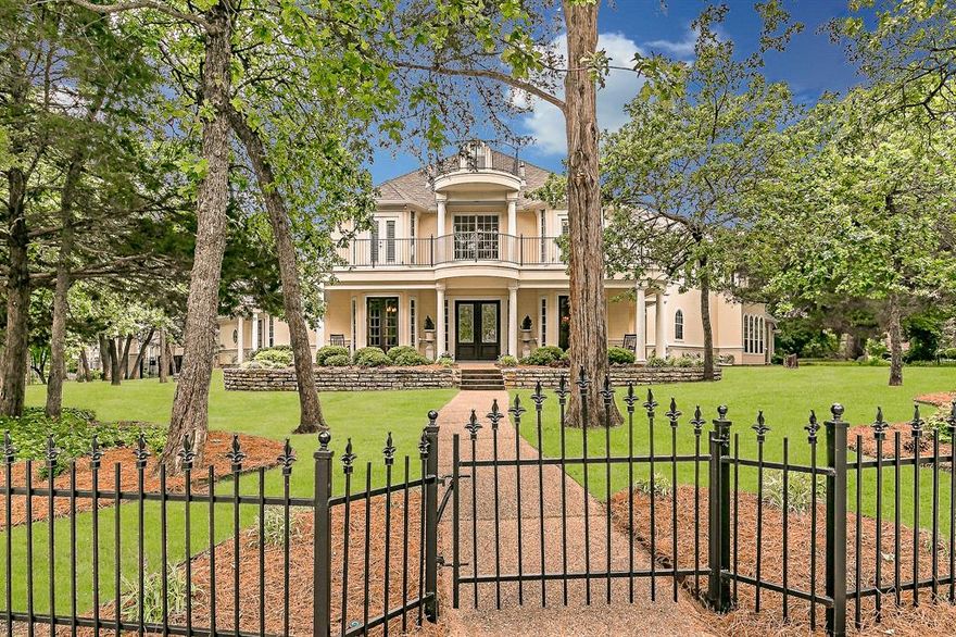 Nestled in one of Southlake’s most sought-after, tree-lined neighborhoods, this classic home exudes Southern charm and timeless elegance. The remodeled kitchen serves as the heart of the home, featuring a spacious island perfect for entertaining. Rustic brick flooring adds warmth, while multiple French doors open to inviting balconies, seamlessly blending indoor and outdoor living. Outside, the park-like yard showcases a sparkling pool, creating a serene and welcoming atmosphere. The property's impressive curb appeal is enhanced by stately columns and a decorative iron fence, framing the home with an elegant touch. The fourth bedroom, located off the balcony, offers a private guest suite complete with a full bath and kitchenette area. Discover unique spaces throughout, including a spiral staircase leading to a secret bonus room and a third-floor balcony.