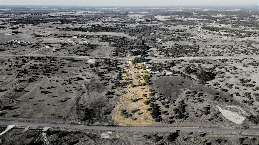 Discover the freedom and flexibility of country living on this beautiful 3.125-acre in Ranches at Star Hollow. Set in the quiet rolling hills of Hood County, this property offers the perfect blend of open space, natural beauty, and modern connectivity ideal for those ready to build a custom home, barndominium, or rural getaway in a private gated community just outside city limits.NO CITY TAXES, NO MOBILE HOMES.  Enjoy panoramic skies, wide open land, and the privacy to live life on your terms. Whether you're planning a forever home, hobby farm, or weekend retreat, this land offers the versatility to match your vision. With electric service and high-speed fiber optic internet available, you're free to enjoy rural space without giving up essential connections. A private well and septic system are required, giving you full control over your utilities and lowering long-term costs. Light restrictions protect property values while still allowing flexibility for modern living. Barndominiums, barns, shops, and guest homes are permitted with approval. Minimum dwelling size is 1,400 square feet. Livestock and chickens are welcome in accordance with community guidelines, making this an excellent option for small-scale homesteading or recreational use.Located just a short drive from Granbury, Weatherford, and the Fort Worth metro area, this land offers peaceful seclusion with convenient access to shopping, dining, and services. Tolar and Lipan ISDs. There is no required building timeline, so you can buy now and build when you're ready.