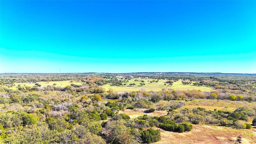 MOTIVATED SELLER!!!!!  This stunning 50-acre ag-exempt property offers the perfect blend of natural beauty and rural privacy, sitting at an elevation of 1,180 feet with expansive views and multiple potential homesites. Located in the desirable Peaster ISD and just 45 minutes from Fort Worth, it's an ideal escape without sacrificing convenience. The land features a mix of scattered timber and open spaces, providing both seclusion and usability. Two seasonal ponds attract abundant wildlife, including deer, turkey, and hogs, making it a haven for nature lovers and outdoor enthusiasts. With gently rolling terrain and plenty of possibilities for development or recreation, this property is a rare find. The owner is motivated and open to serious offers, making this a unique opportunity to own a piece of Texas countryside with incredible potential.