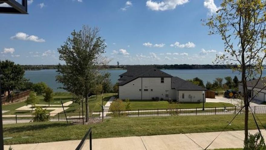 Beautiful New Lakefront Home! This stunning two-story residence offers 4 bedrooms, 4 full bathrooms, a private study, and two spacious living areas. Enjoy breathtaking lake views from the master suite, upstairs living area, balcony, and an additional bedroom. The home features soaring vaulted ceilings, stainless steel appliances, and quartz countertops. Two bedrooms plus a study are conveniently located on the main level, and each bedroom includes its own private bathroom.