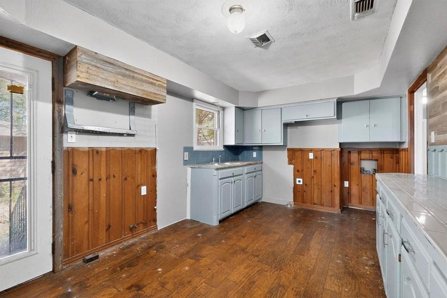 Awesome opportunity to buy in a well-established location with ample potential to make it your own! Full of original charm with great bones & hardwood floors throughout, all this home needs is a little TLC to become your perfect home base. Featuring 3 sizable bedrooms, 2 full baths (previously 1.5), open living & dining areas, and a large kitchen with backyard views. Set on a spacious 0.26-acre lot covered by shade trees, this property offers plenty of room to relax, garden or entertain, with a 2-car garage tucked behind the home. Located in a quiet neighborhood known for its friendly atmosphere & tree-lined streets, minutes to Downtown Dallas + tons of amenities. Not to mention steps from local schools, neighborhood parks, playgrounds, walking trails & Keeton Park Golf Course! **This home is eligible for $10K in DOWN PAYMENT ASSISTANCE + up to $5K in CLOSING COSTS.**