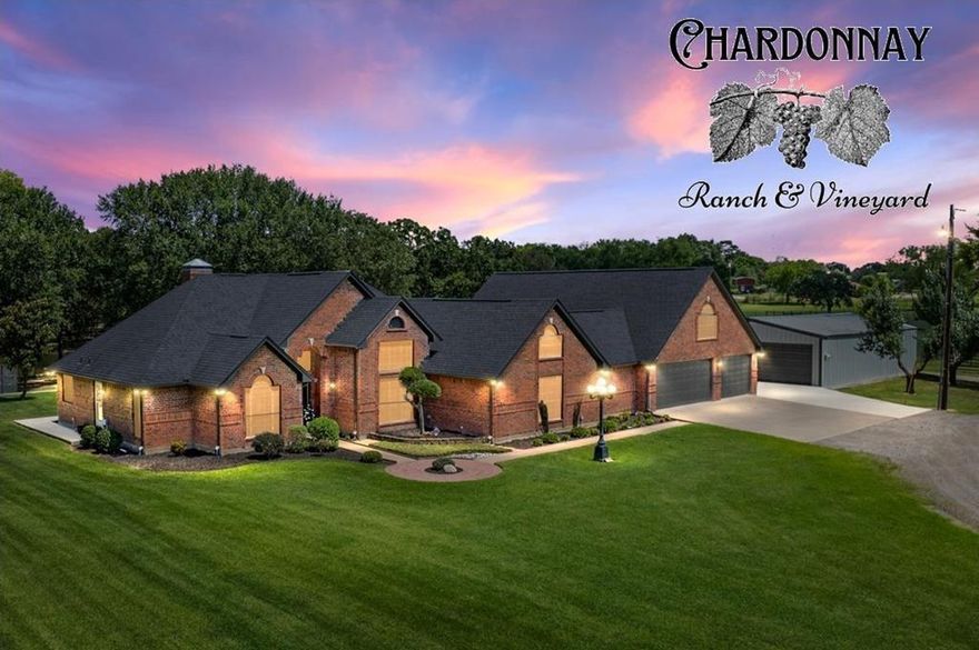 Vine & Branch Ranch has also become a well-loved site for weddings and family gatherings and photos. Its and excellent location, near HWY 198 and HWY 175 only 45 minutes from the DFW Metroplex, makes this an ideal setting for an Event Center or Winery. A Countryside Dream Estate, Over Twenty Acres of Pure Texas Living! Welcome to your retreat located in the quiet countryside, where almost twenty AG-exempt acres bring together natural charm and upscale comforts. Open pastures, grand oaks, and calm ponds set the stage for a lifestyle of tranquility, recreation, and opportunity. A picturesque tree-lined driveway leads past your private vineyard to a fully updated home, designed with meticulous care. The charming brick house boasts high-end finishes, large windows that welcome sunlight, a cozy living room with a fireplace, and a farmhouse-style kitchen. Spa-inspired bathrooms, along with rooms for crafting or media, extra storage add even more character. The main house includes 3 bedrooms with oversized walk-in closets, a loft and 2 bathrooms with a connected 3-car garage. A separate one-bedroom, one-bath guest home (900sf) comes complete with its own kitchen and generous living area, making it ideal for guests or creative pursuits. Venture outside to find a Field of Dreams – your private baseball field and lighted basketball court, perfect for family activities or evening practices. Take a dip in the sparkling pool or unwind in the hot tub, surrounded by expansive covered decking and patio spaces, ideal for gatherings. Wine enthusiasts will be delighted by the irrigated and carefully tended grapevines with over 700 plants.