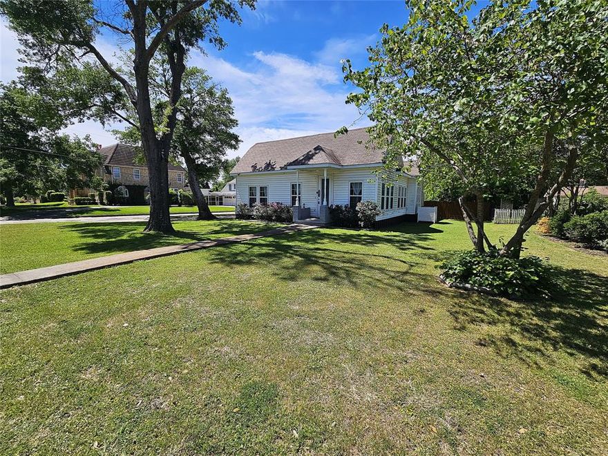 Beautifully renovated and truly move-in ready, this charming home on Ross Avenue in Mexia offers the perfect blend of modern upgrades and comfortable living in a desirable neighborhood. This 3 bedroom and 2 bathroom home features 1,872 square feet and has been thoughtfully updated over the past few years. The property features recent wiring, plumbing, roof, HVAC system, high-efficiency windows, water heater, flooring, and fencing—providing peace of mind for years to come.  Step inside to discover a bright, open-concept floor plan enhanced by raised ceilings and abundant natural light from numerous windows. The custom kitchen is a standout, showcasing granite countertops, stylish finishes, and plenty of space for cooking and entertaining.  The primary suite offers a relaxing retreat, complete with an ensuite bath and a large closet featuring built-in cabinets and drawers, plus an additional closet for extra storage.  Situated on a generous corner lot just over a quarter acre, the exterior amenities are just as impressive. Enjoy the convenience of a half-circle drive, carport, storage building, and even a chicken coop. The fully fenced backyard provides privacy and plenty of room to enjoy outdoor living.  This beautifully updated home has it all—style, space, and functionality. Come see it today and fall in love!