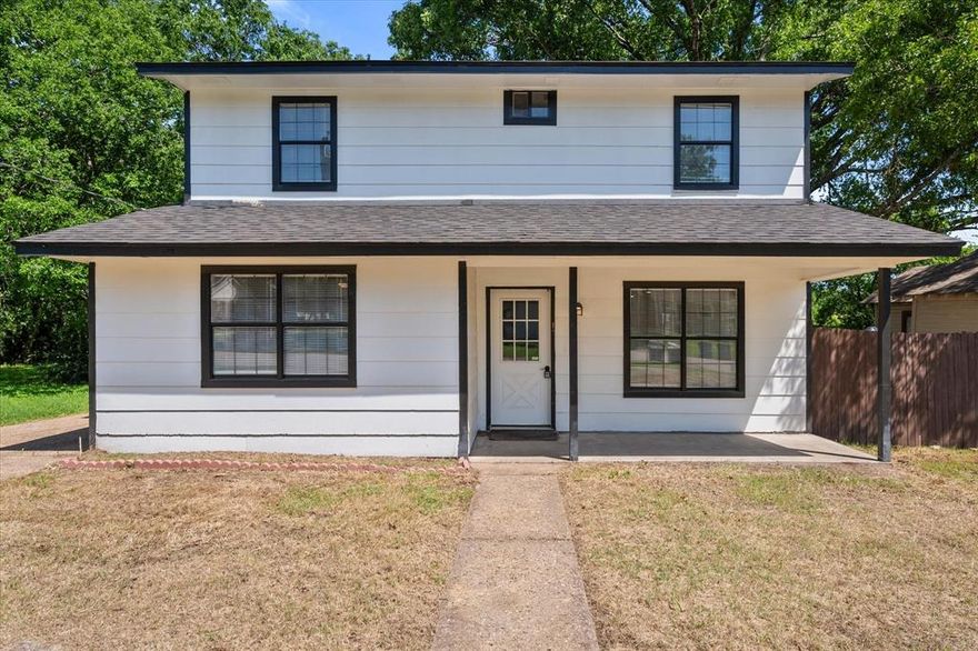 Welcome to 1312 E Collin Street — a beautifully updated two-story home that blends modern touches with timeless charm. This freshly painted exterior features a crisp white facade accented by sleek black trim, offering standout curb appeal. Situated on a spacious lot with mature trees, the home provides both shade and privacy, perfect for enjoying the outdoors. Step inside to discover a bright and inviting layout ideal for family living or entertaining guests. Large windows throughout the home fill each room with natural light. The front porch offers a perfect spot for morning coffee or evening relaxation.